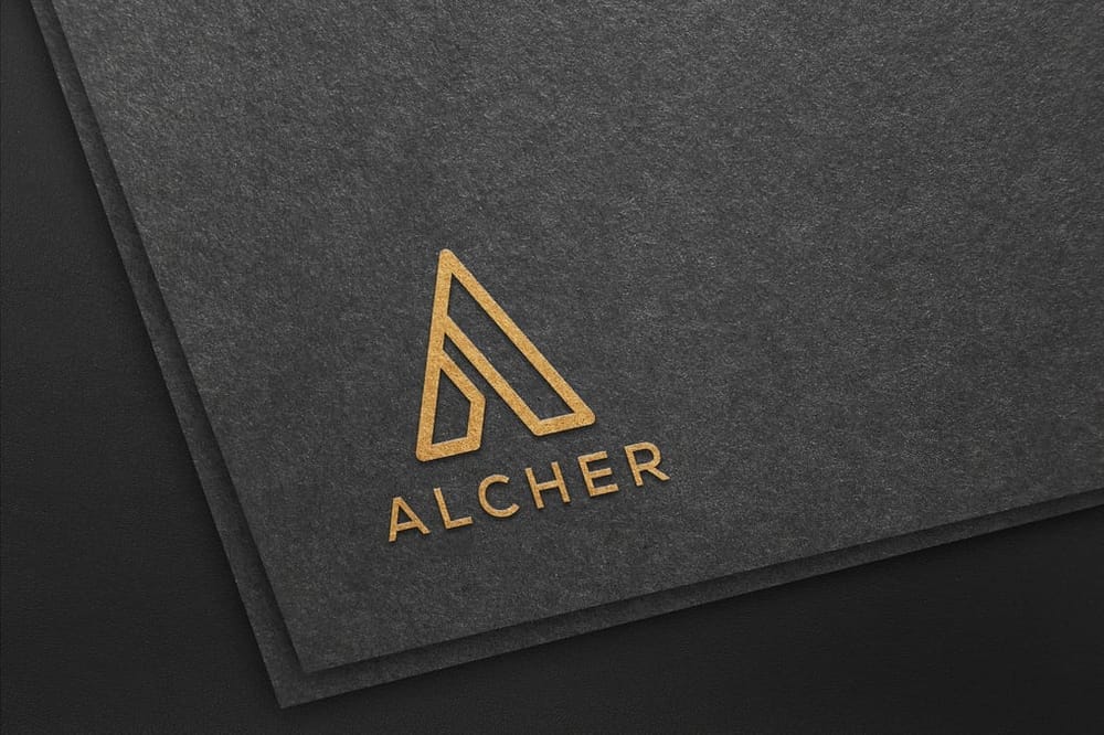 Alcher Logo Mockup On Black Paper